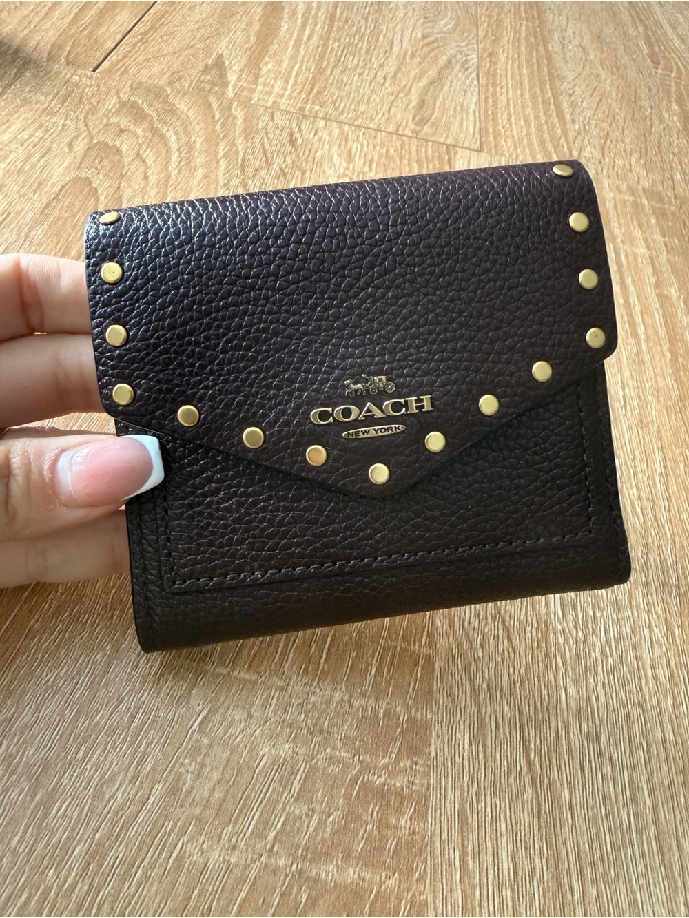 Coach oxblood wallet with rivets